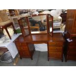 A solid mahogany triple mirror backed dressing table with brass knobs (COLLECT ONLY)