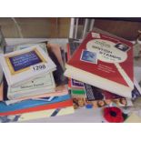 A quantity of Stanley Gibbons catalogues and other stamp related books.