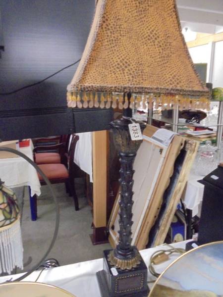 A tall good quality table lamp with beaded shade.