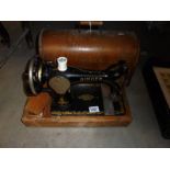 A cased Singer hand operated sewing machine, COLLECT ONLY.