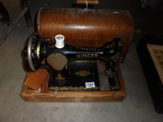 A cased Singer hand operated sewing machine, COLLECT ONLY.