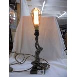 An art deco style figural table lamp.