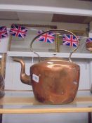 A large old copper kettle.