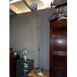 An aluminium floor standing standard lamp with flexible neck