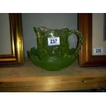 A vintage green glass jug & bowl