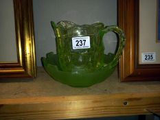A vintage green glass jug & bowl