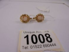 A pair of 18ct gold cameo set earrings, 4.2 grams.