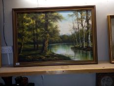 A large oil on canvas woodland water scene, 101cm x 71cm (COLLECT ONLY)