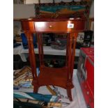 A dark wood stained kidney shaped side table with drawer on multiple columns, 57cm x 39cm x 73cm