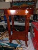 A dark wood stained kidney shaped side table with drawer on multiple columns, 57cm x 39cm x 73cm