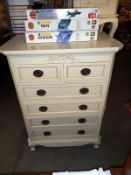 A good quality 2 over four white/cream chest of drawers