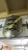 A Heraldic display shield with 3 black lions over a yellow strap with a pair of swords. COLLECT ONLY