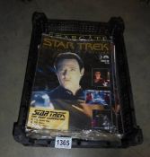 A quantity of Startrek and Stargate magazines.