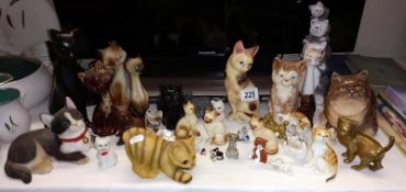 A quantity of cat ornaments