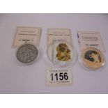 Three commemorative coins - Saint George and the Dragon, Shrines of Europe and The Holy Trinity.