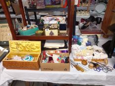 A good lot of vintage sewing items including cotton reels, large tin of buttons etc