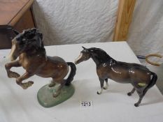 A Beswick rearing horse and one other.