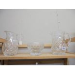 Two cut glass jugs and a cut glass bowl.
