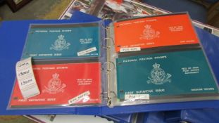 Four folders of Isle of Man stamps including souvenir packs, miniature sheets, booklets, definitives