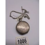 A silver full hunter pocket watch on a 30 gram silver watch chain.