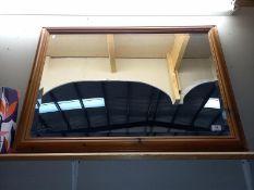 A large pine framed bevel edge mirror