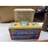 A boxed set of Beatrix Potter 'The World of Peter Rabbit' and a boxed set of Thomas The Tank Engine