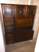 A dark wood stained side board/wall unit