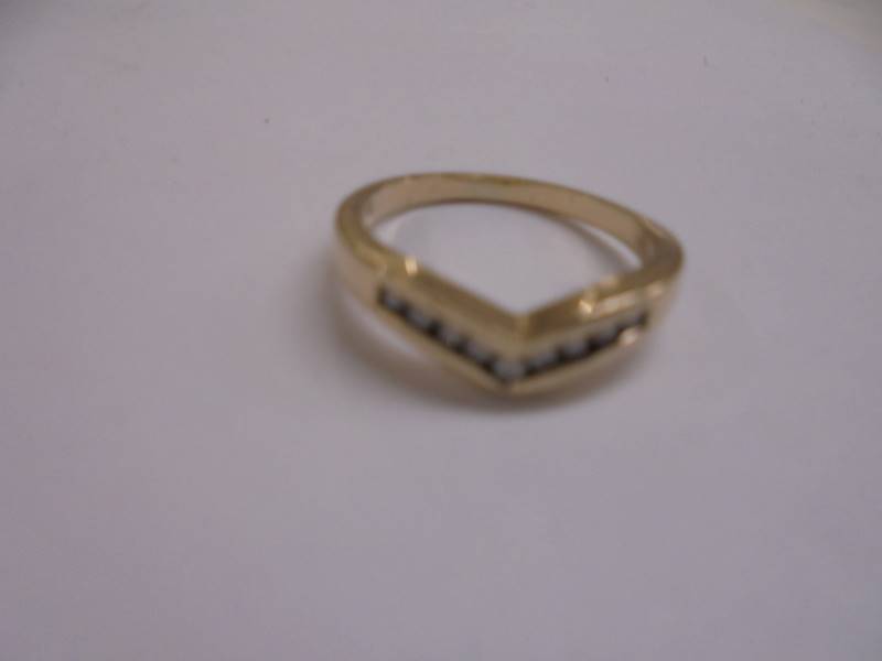 A nine diamond wishbone ring in 9ct gold, size N, 2.6 grams. - Image 2 of 2