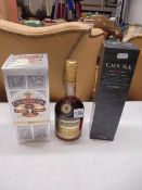 A boxed Chivas 12year blended Scotch whisky, a Coal Ila 12 year whisky and a Three Barrels whisky.