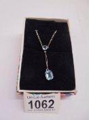 A 9ct gold drop pendant set blue stone, stamped 9ct.