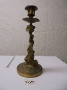 A Victorian brass sea serpent candlestick.
