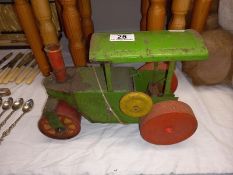 A vintage tinplate clockwork steam roller