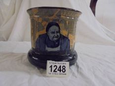 An attractive Doulton D2385 painted plant pot showing an innkeeper and his inn.