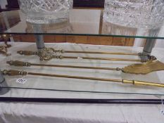 A good set of three brass fire irons.