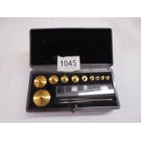 A vintage bakelite boxed Baird & Tatlock Ltd., Hatton Garden, London precious metal weights.