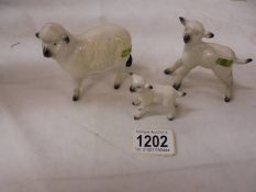 A Beswick sheep and two lambs.