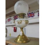 A Victorian brass oil lamp with hand painted font., COLLECT ONLY.