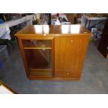 A teak effect music centre cabinet with cutglass door and lift up lid 89cm x 49cm x height 81cm