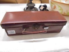A small rectangular vintage glove case.