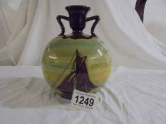 An attractive round bulbous vase or candle holder with two shoulders. Brown with paintings of yachts