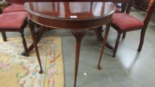 A mahogany D shaped hall table. COLLECT ONLY.