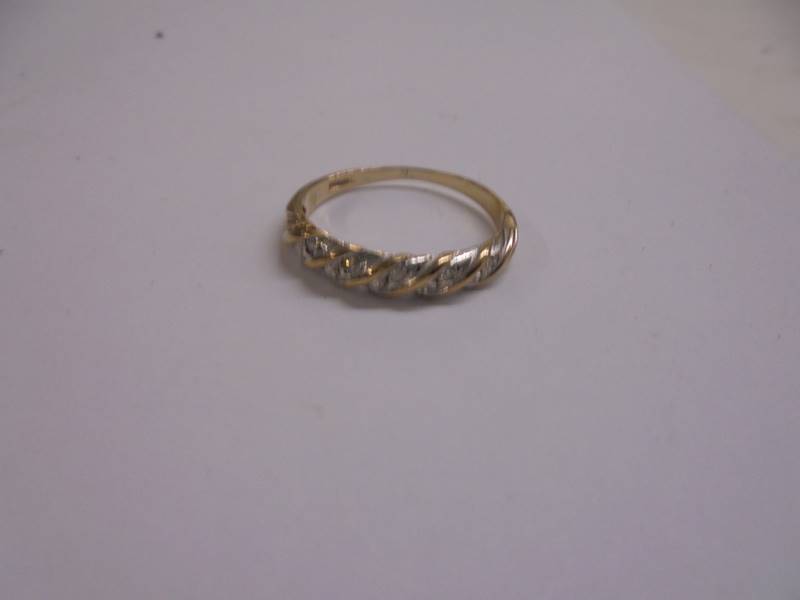 A diamond set band ring set with ten diamonds in 9ct gold, size O, 1.7 grams. - Image 2 of 2