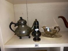 A silver plated gravy boat on plate, sugar sifter & teapot