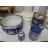 A Wedgwood Jasper ware biscuit barrel, fruit bowl, tankard and cigarette lighter.