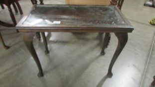 A pad foot table with carved top. COLLECT ONLY.