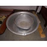 A large galvanised metal pail & 1 other