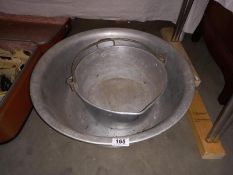A large galvanised metal pail & 1 other