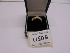 An 18ct gold ring set white stones, size P half, 4 grams.