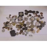 A mixed lot of UK and foreign coins including crowns, £5 etc.,