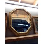 A large gilt frames octagonal bevel edge mirror, 66cm x 82cm (COLLECT ONLY)
